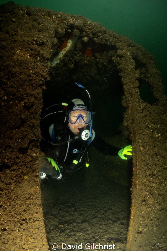 Diver exits cabin of sunken boat at the Welland Scuba Park. by David Gilchrist 