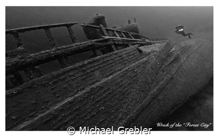 A tech diver on the starboard side of the "Forest City" t... by Michael Grebler 