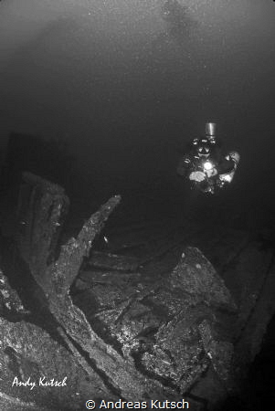 Diver along a small wreck in the adriatic by Andreas Kutsch 