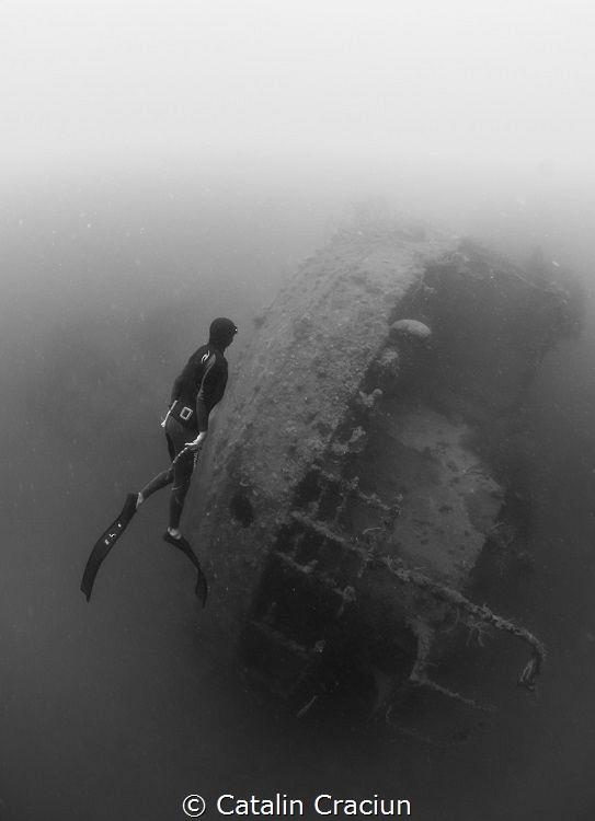 Freediver at Morazan Maru , Japanese WWII ship wreck in C... by Catalin Craciun 