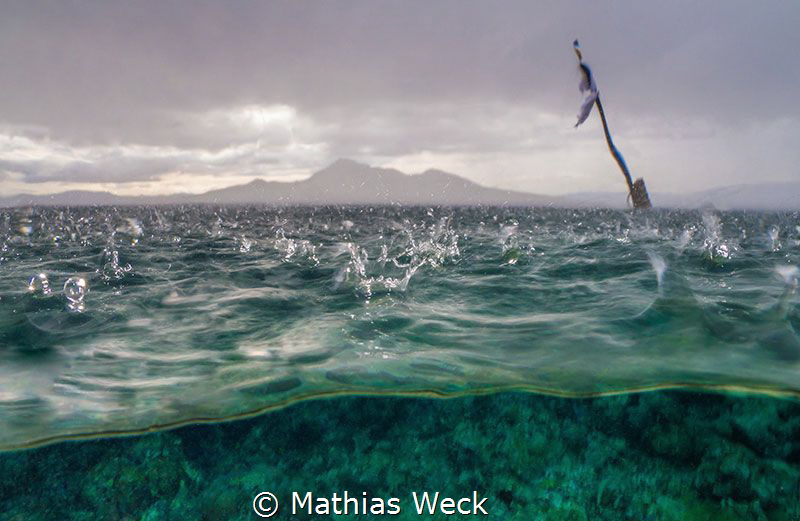 Tropical rain at Bunaken Island by Mathias Weck 