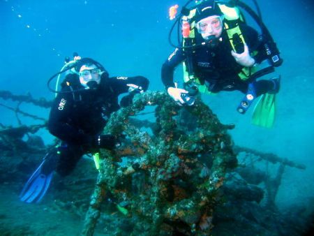 Divers on wheel of the wreck of the Teti, taken with Cano... by Michael Moore 
