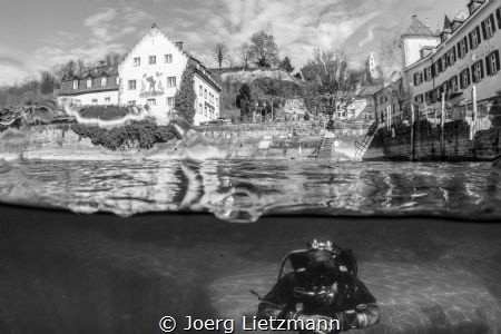 A great divespot during winter. A wild man above and unde... by Joerg Lietzmann 
