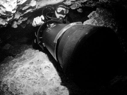 Diver scootering through Jackson blue cave in Marianna FL. by Becky Kagan 