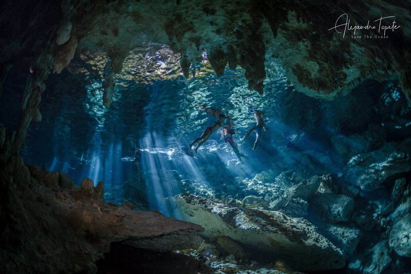 Swiming in the Cenote, Playa del Carmen Mexico by Alejandro Topete 