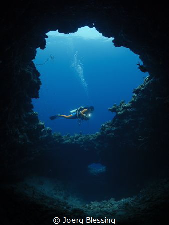 Our little blue hole in Baa Atoll...more of a chimney wit... by Joerg Blessing 