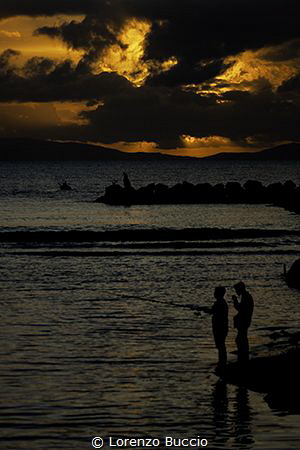 The sunset and the fishermen by Lorenzo Buccio 