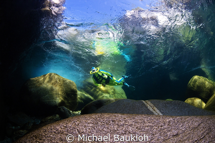 Behind the waterfall in the river by Michael Baukloh 