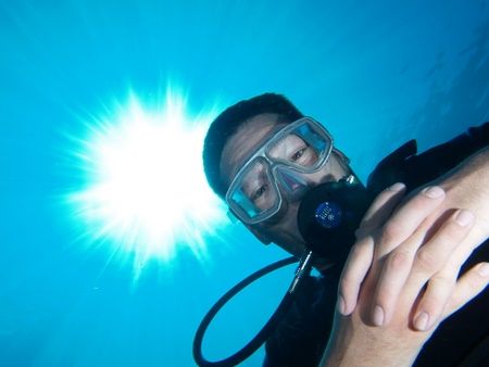 "Buddy" portrait and sunburst taken at Sharksbay with E300. by Nikki Van Veelen 