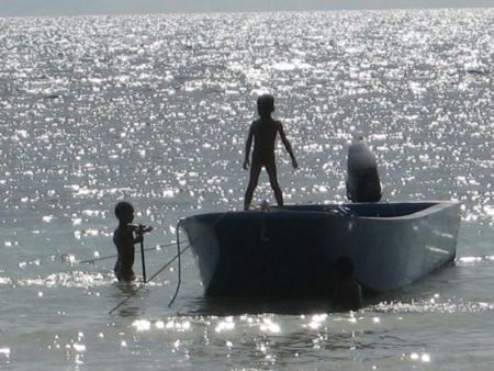 Thai children playing during sunset by Jasminka Hoek 