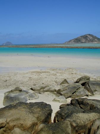 Secluded beach on a desert island. by Christine Huffard 