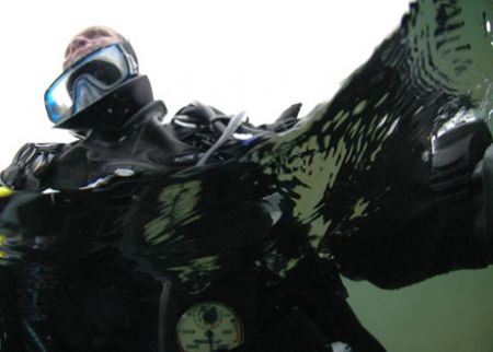 Cold water diver in Michigan lake, November. by David Heidemann 