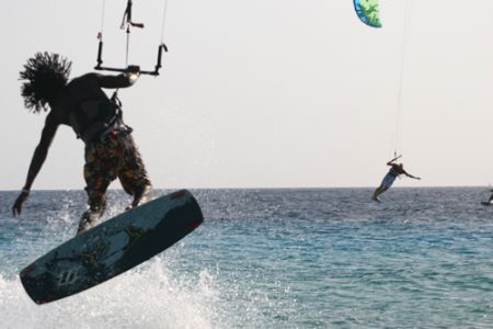 A Bonaire local displays his capabilities on his Kite Sur... by Terry Moore 