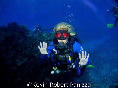 Diver swimming through a channel in Lanai, Hawaii.
Olymp... by Kevin Robert Panizza 
