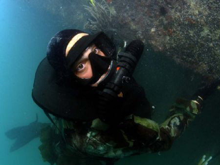 US Navy SEAL at work (released) by Andrew Mckaskle 