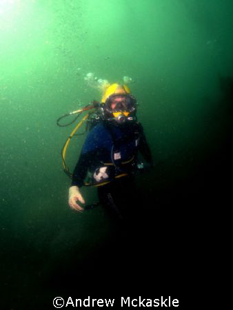 Surface supplied diver working on the bottom. by Andrew Mckaskle 