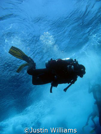 Crashing into the deep off Abu Nuhas, Red Sea, Egypt.
I ... by Justin Williams 