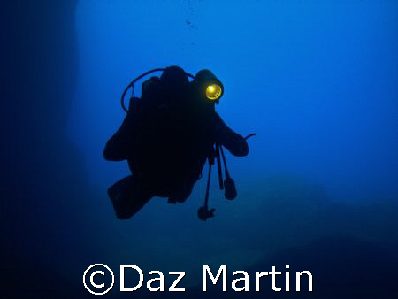 My Mate entering Cathedral Cave on Comino, Malta, May 2007. by Daz Martin 