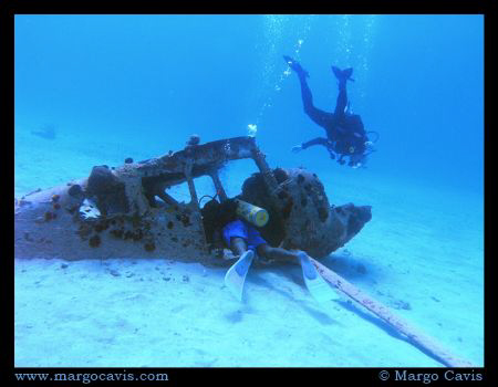 2 divers with a plane wreck in Jamaica. by Margo Cavis 