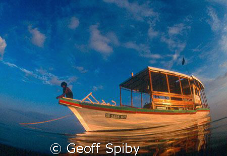 returning to our diving dhoni at the end of a late aftern... by Geoff Spiby 