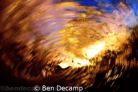 Empty wave at sunset looking out, surfer's perspective. by Ben Decamp 