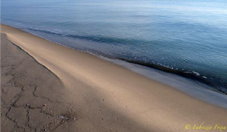 A simple beach caressed by the first light of morning. 
... by Fabrizio Frixa 