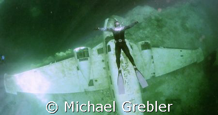 Free Diver over plane, photo taken March 16 under the ice... by Michael Grebler 