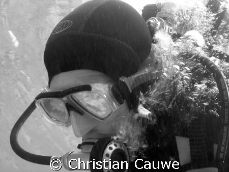my son Vic, smoking water by Christian Cauwe 
