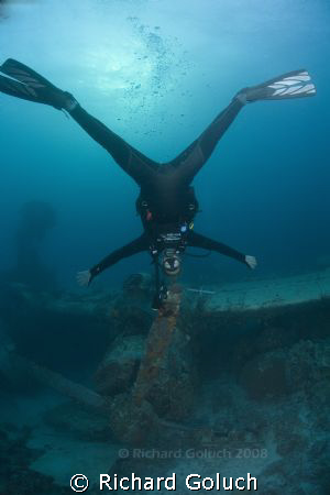 Human propeller over engine propeller-Truk Lagoon by Richard Goluch 