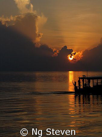 Quiet sunset with the distant sound of boat engine, shado... by Ng Steven 