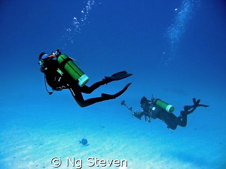 Eager decending photographer on a trigger by Ng Steven 
