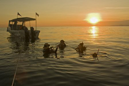 Goin down for nightdive in Mabul  by Soren Egeberg 