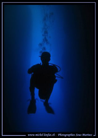 Diver in the cave of the Inland Sea in Gozo - Malta by Michel Lonfat 