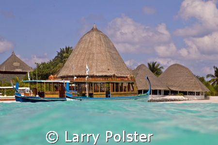 Beautiful waters of Angaga Island by Larry Polster 