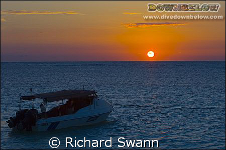 Sunrise over our dive boat, Lankayan island Sabah Borneo.... by Richard Swann 