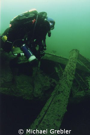 Rebreather diver on the wreck of the hospital ship "Letit... by Michael Grebler 