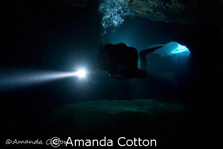 Technical Diving. Cave diver entering into the no light z... by Amanda Cotton 