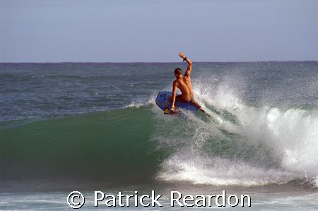 Boogie boarder carves up the waves in Kauai, Hawaii.  Sta... by Patrick Reardon 