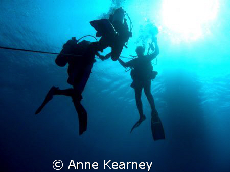 5 meters stop, holding on a rope because of the current t... by Anne Kearney 