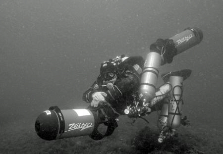 Diver with stages and 2 scooters by Andy Kutsch 