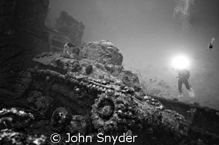 Diver shooting Tank in Truk Lagoon by John Snyder 
