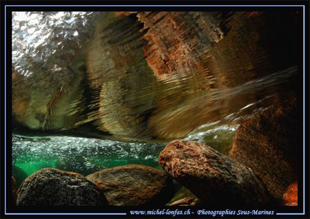 Fresh Water Reflection.... in the water's of the Verzasca... by Michel Lonfat 