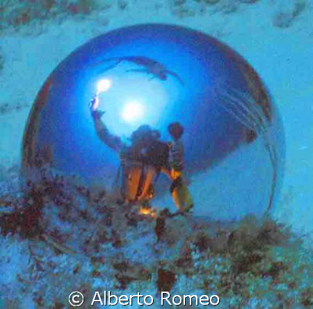 SELF PORTRAIT WITH DIVER IN THE SURFACE AND SUNLIGHT REFL... by Alberto Romeo 