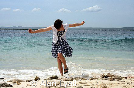 Carefree in Bonaire - my daughter getting her feet wet at... by Alan Lyall 