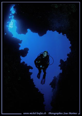 Caroline my wife, entering the crack of the Canyon. Most ... by Michel Lonfat 
