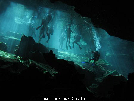 "Blue Fins"   A group of tourist divers prepares to explo... by Jean-Louis Courteau 