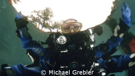 Snell's window & surrounding reflection gives this view o... by Michael Grebler 