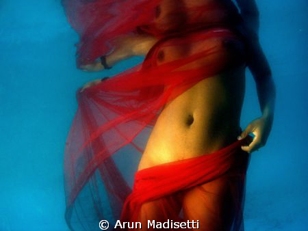 Woman in Red.
Original image, with side lighting from th... by Arun Madisetti 