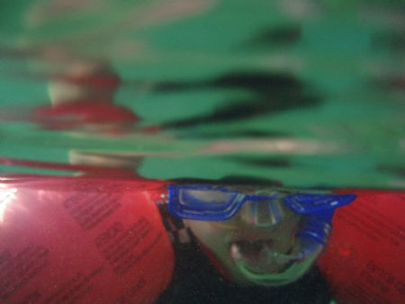 Over/under shot of four year-old Jake on his first snorkel! by John Taylor 