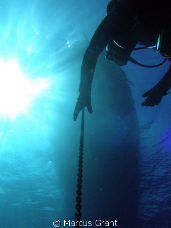 A Diver seting up for his stop after a dive on the P31 wr... by Marcus Grant 